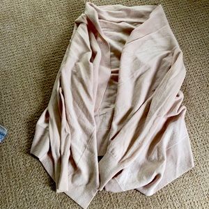 Light rose coloured cardigan sleeved shrug